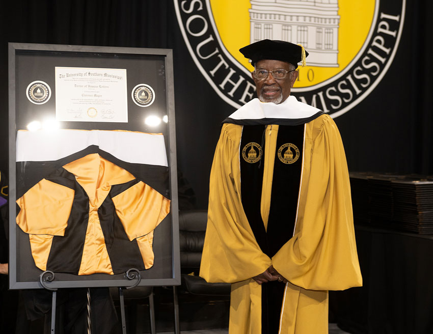Mr. Magee with his framed degree
